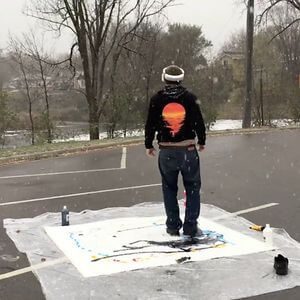 Artist Paints With His Feet While Viewing From An Overhead Drone With A Vr Helmet In A Snowstorm