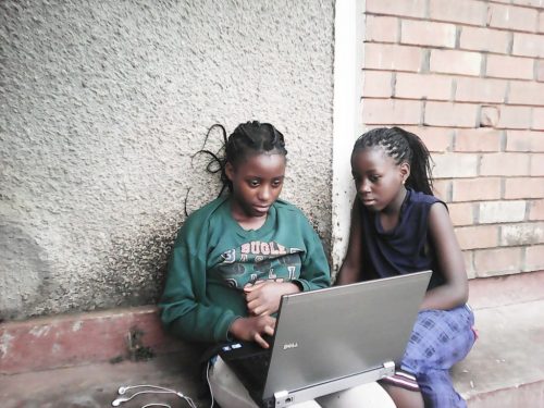 Two girls at a laptop. Joel Bayubasire CoderDojo — 2000 Dojos