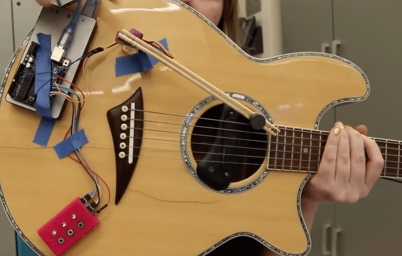 Automatic guitar strumming with Arduino Uno and chopsticks