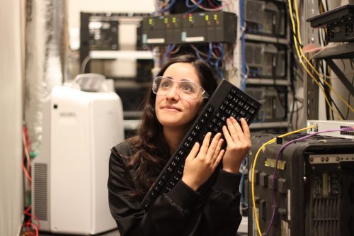 A woman wearing safety goggles hugging a keyboard Estefannie Explains it All Raspberry Pi