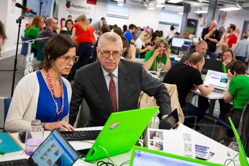 Prince Andrew and a woman watching a computer screen