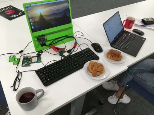 Two computers and two pastries