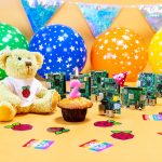 A celebratory photo of a birthday party for Raspberry Pi computers