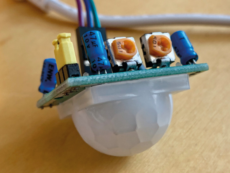 Figure 1. The PIR sensor’s potentiometers (orange). Adjust carefully with a small screwdriver, as they can be fragile