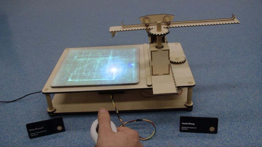 This joystick-controlled machine draws light trails using a laser