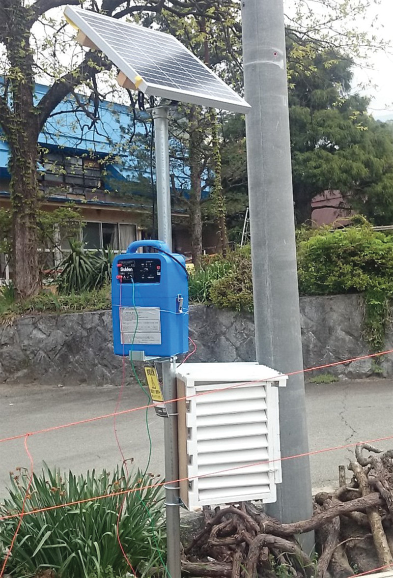 The second box is near one of the electric fences used to keep animals out