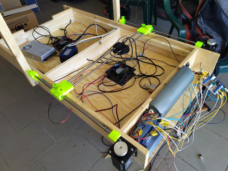 The inner workings of the table revealing the two fans and extensive wiring required