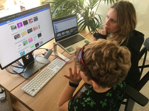 A mother and child coding at home