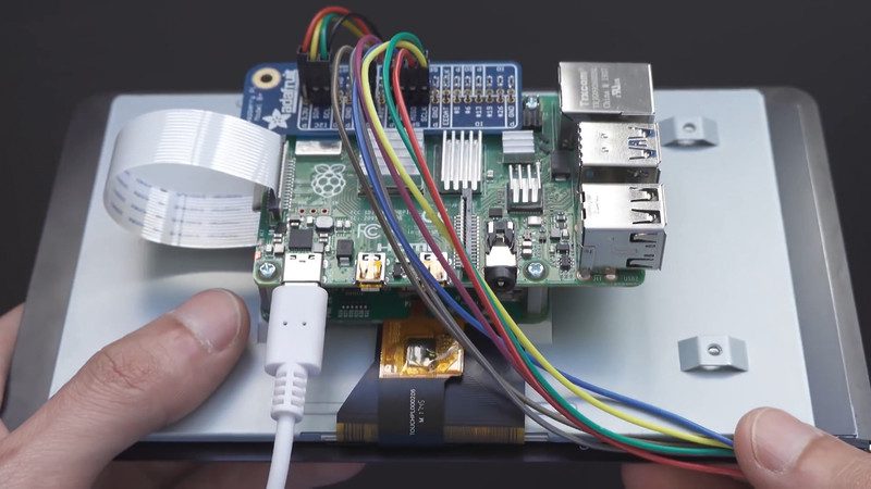 	A Raspberry Pi 3 sits in the housing and connects to a LiPo battery that also powers the LEDs and motors