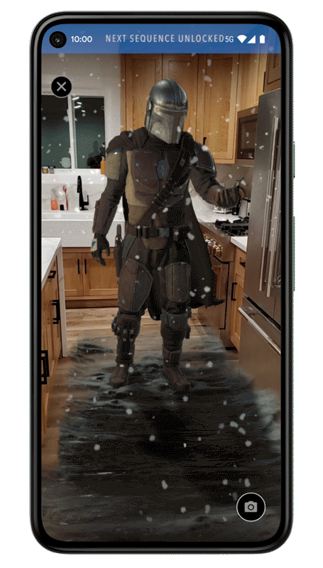 Animated GIF showing the character the Mandalorian in AR standing in someone's kitchen on the screen of a Pixel phone.