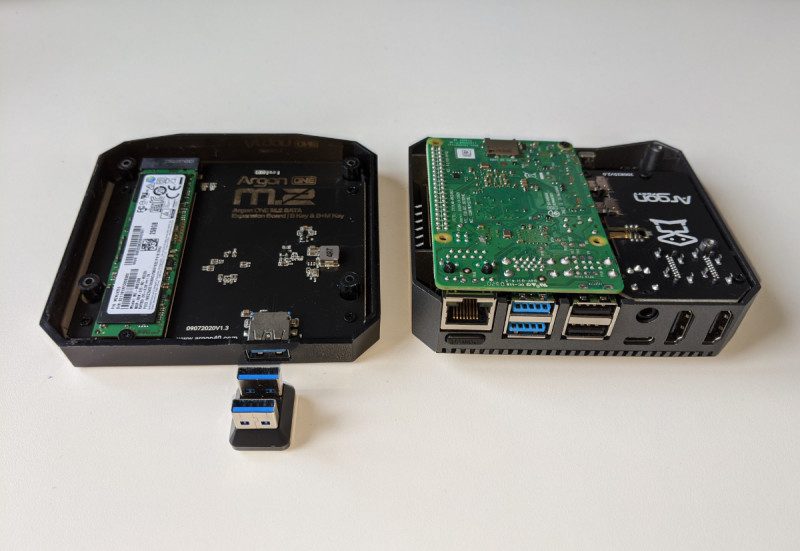 The two halves of the case connect together with a U-shaped USB 3.0 connector bridging the M.2 SSD SATA drive to Raspberry Pi 4