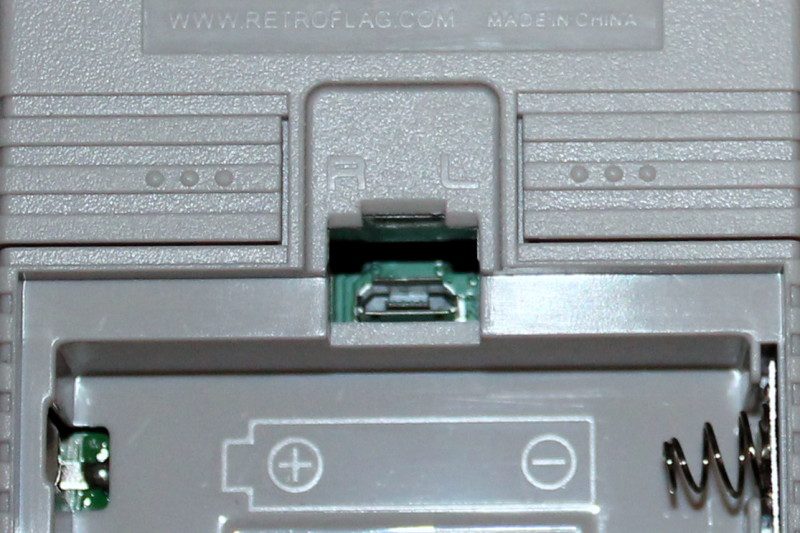 A micro USB port under the GPi's battery cover can provide USB peripheral connectivity via a powered hub