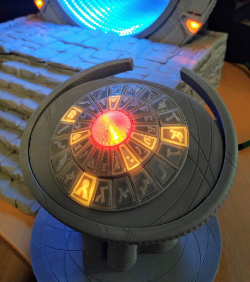 A close up of the stargate control panel with glowing orange touch buttons