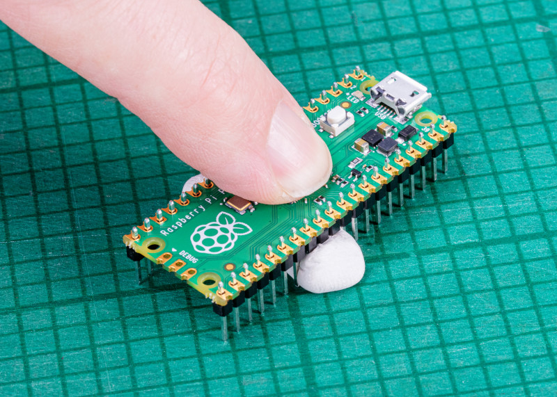Figure 1 You can hold the headers in place with sticky putty before soldering