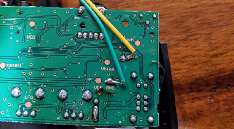 Just two connections need to be soldered on the back of the well-labelled Korg Monotron PCB: one to the gate pad and the other to the GND pad