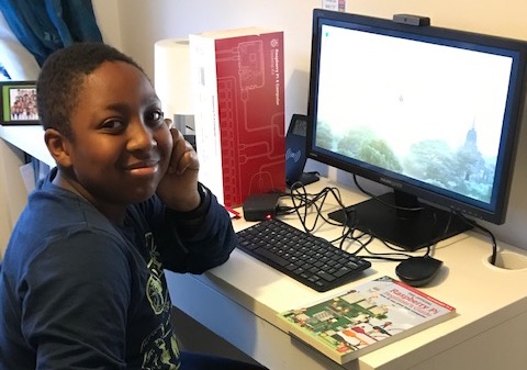 A young person receives a Raspberry Pi kit to learn at home