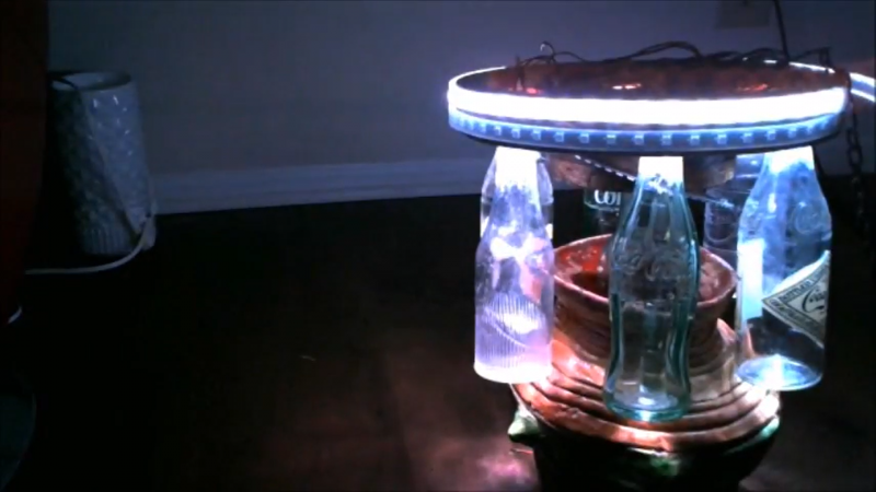 A MonthOfMaking project: a homemade chandelier consisting of glass bottles and an LED ring