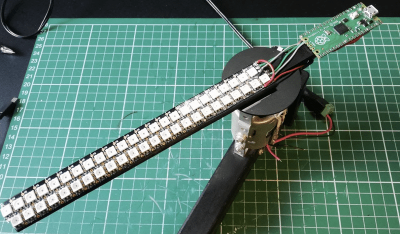 Mounted on the other end of the rotating arm, Raspberry Pi Pico controls the LEDs
