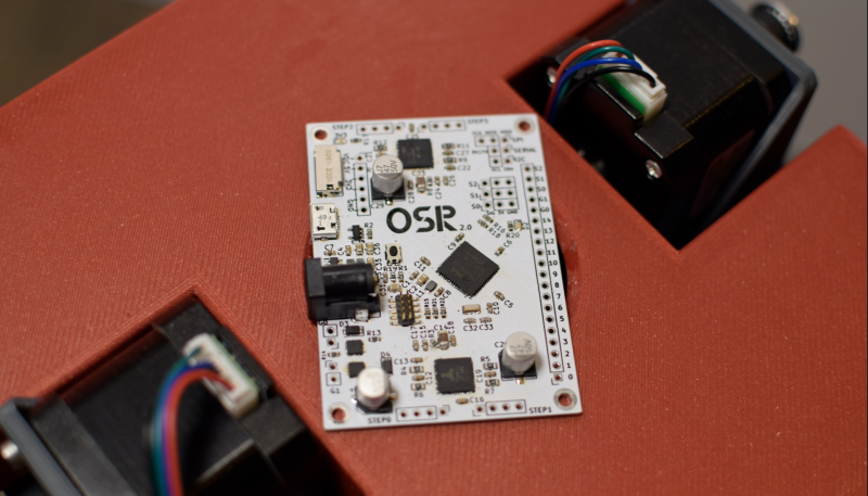 Andrew’s own four-axis control board (dubbed the OSR control board) communicates with Raspberry Pi via USB and controls all the stepper motors