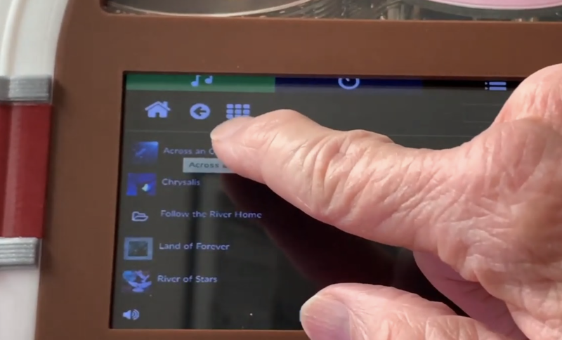 Bob selects a song on the touchscreen panel, which shows Volumio’s intuitive user interface