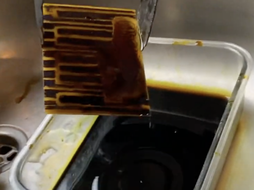 piano coming out of black liquid