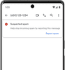 A phone screen shows a âsuspected spamâ warning underneath a phone number, with the option to âreport spam.â