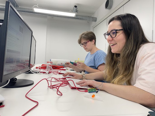 Two members of the Code Club working at computers.