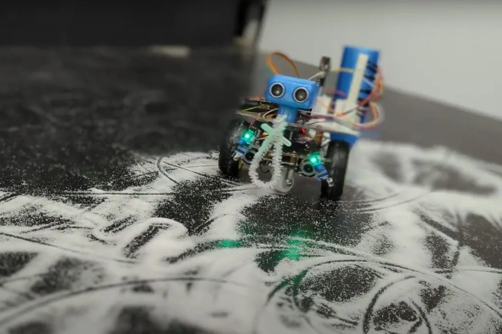 The Whimsy Artist is a little robot that both creates and destroys art