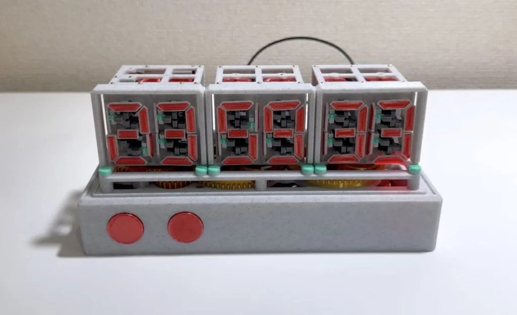 A single stepper motor drives this mechanical seven-segment display clock